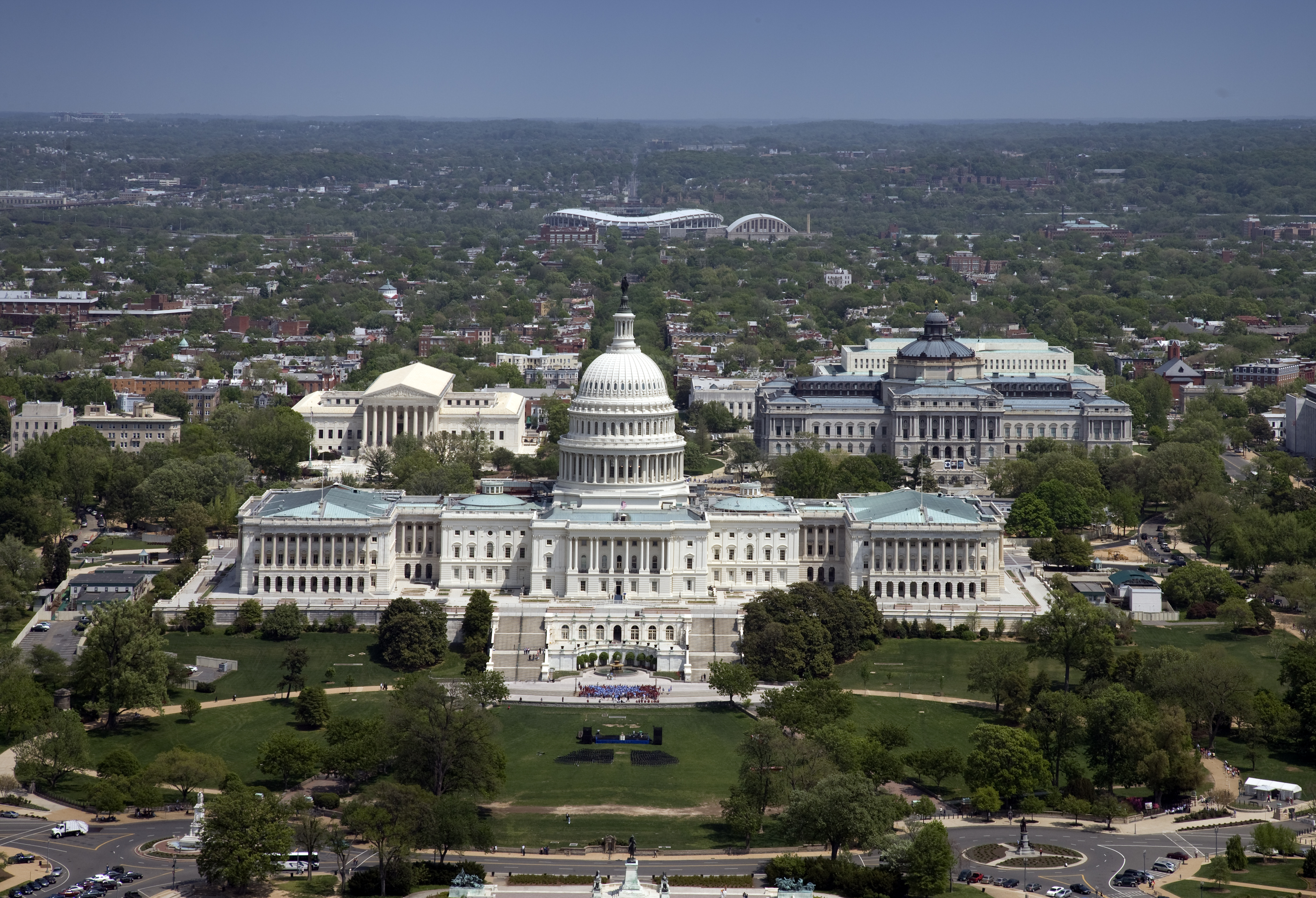 Aerial view of Washington D.C. showing the Capitol Building, National Mall, and monuments