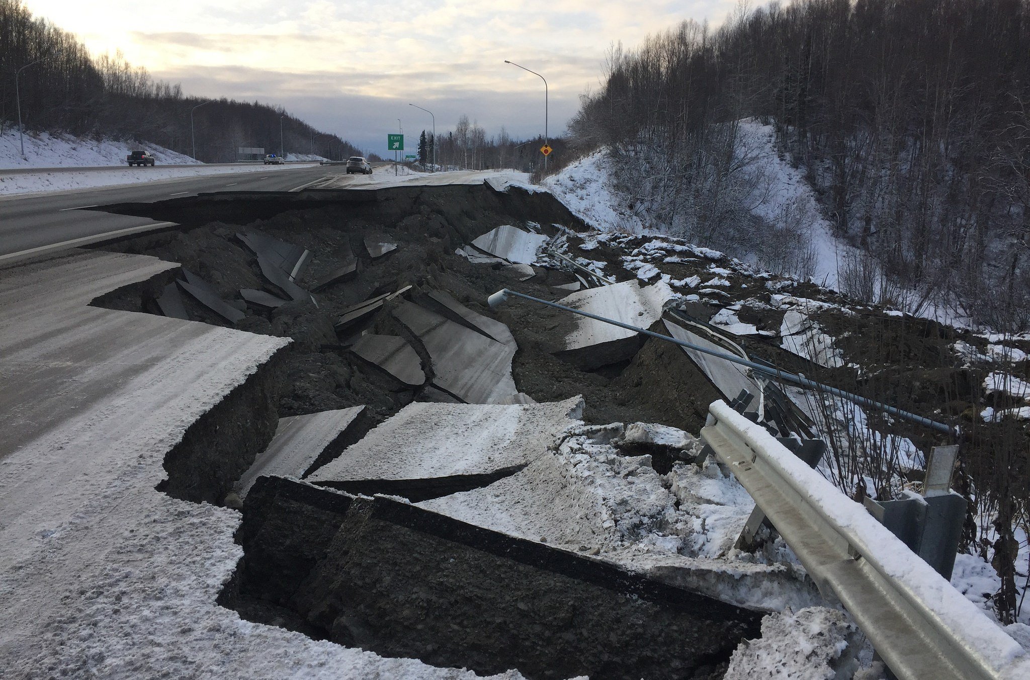 Cracked road with large fissure after major Alaska earthquake
