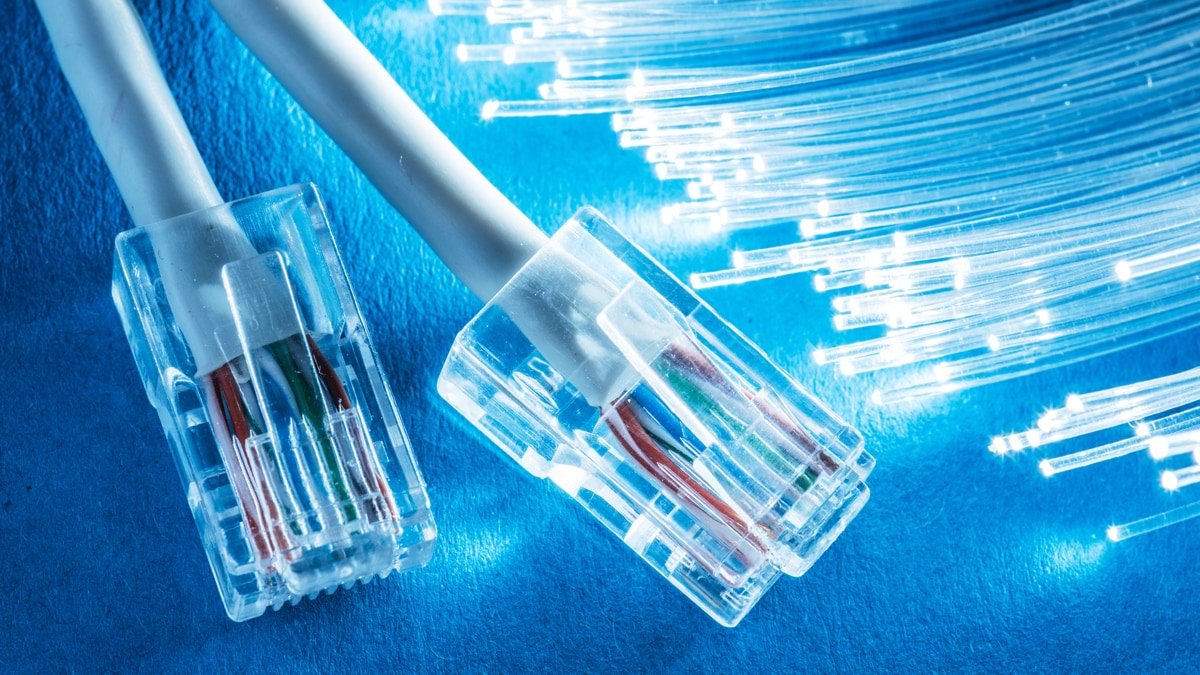 Fiber optic cables connecting to a high-speed internet router