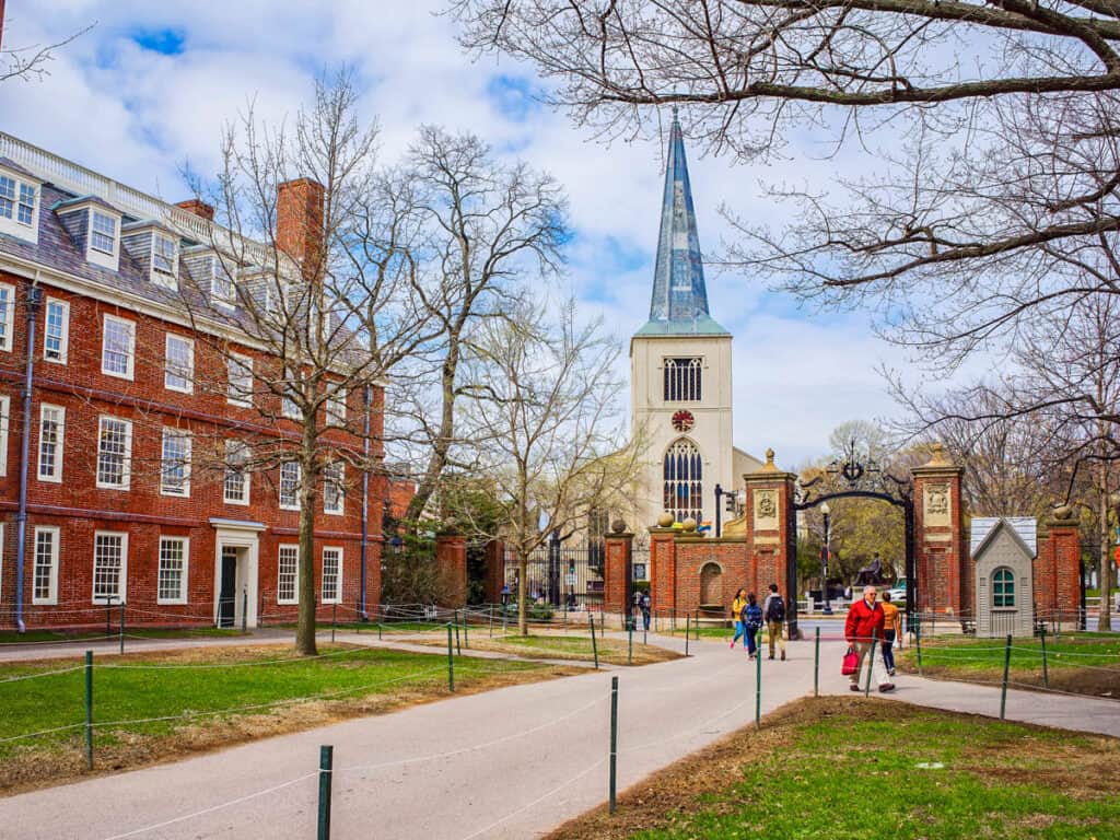 Historic red brick buildings and gates at Harvard University, America's oldest university