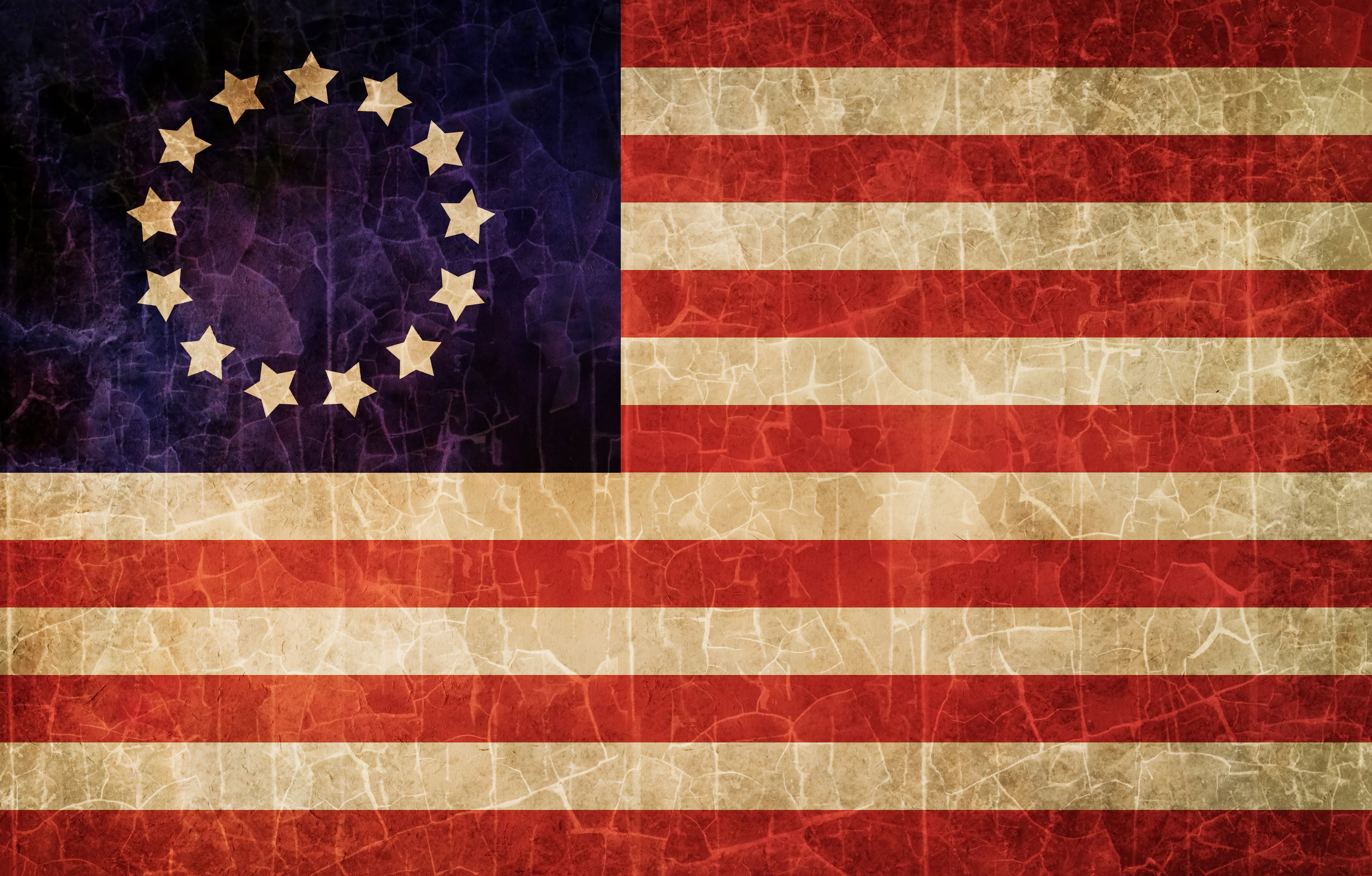 Historical American flags showing evolution from 13 stars to 50 stars