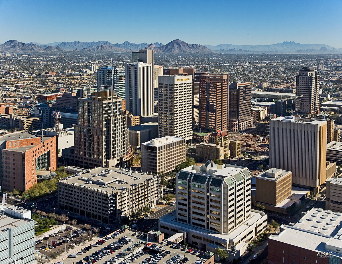 Phoenix skyline with urban buildings and mountains in background