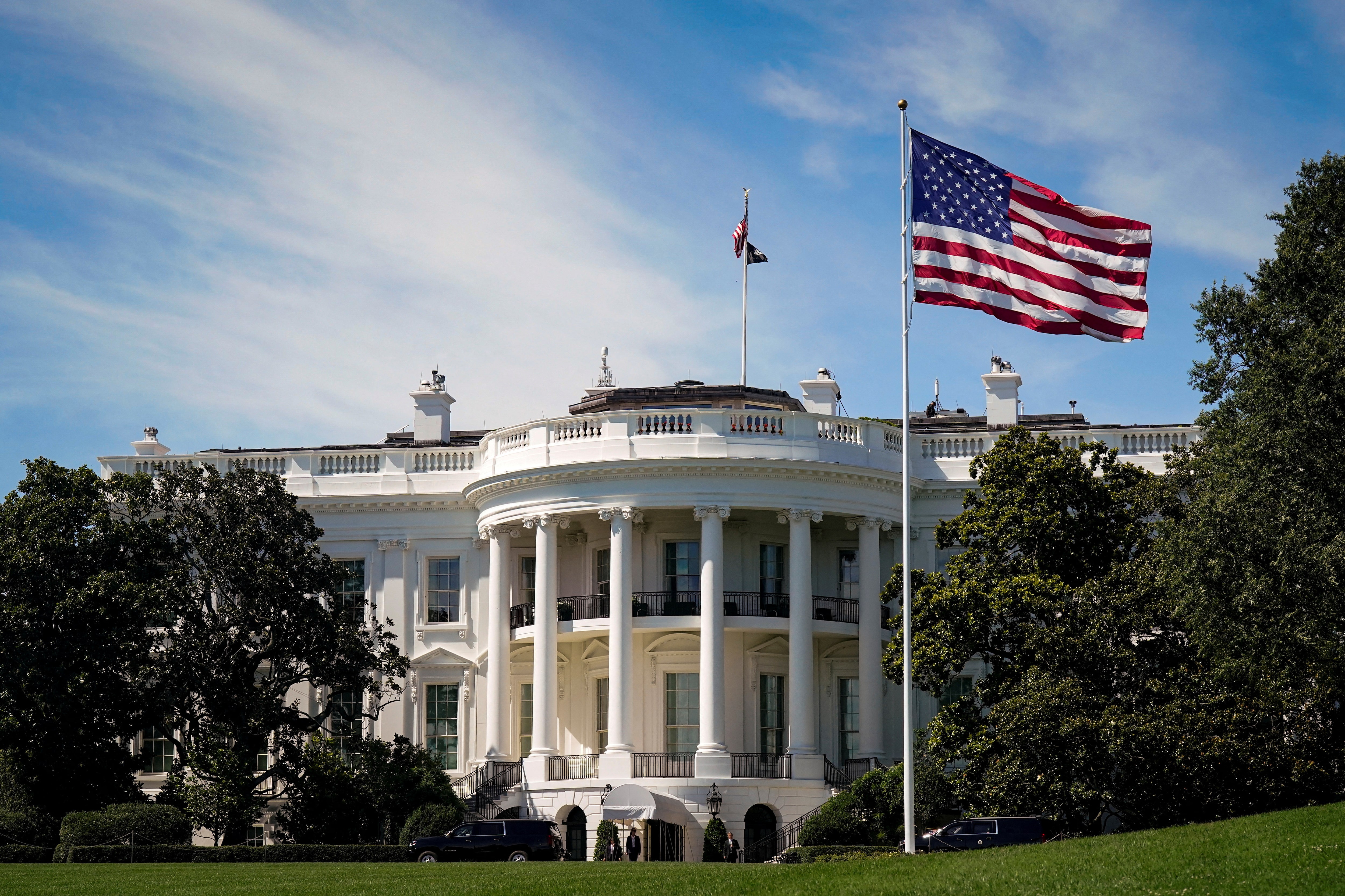 The White House with American flag flying prominently in front