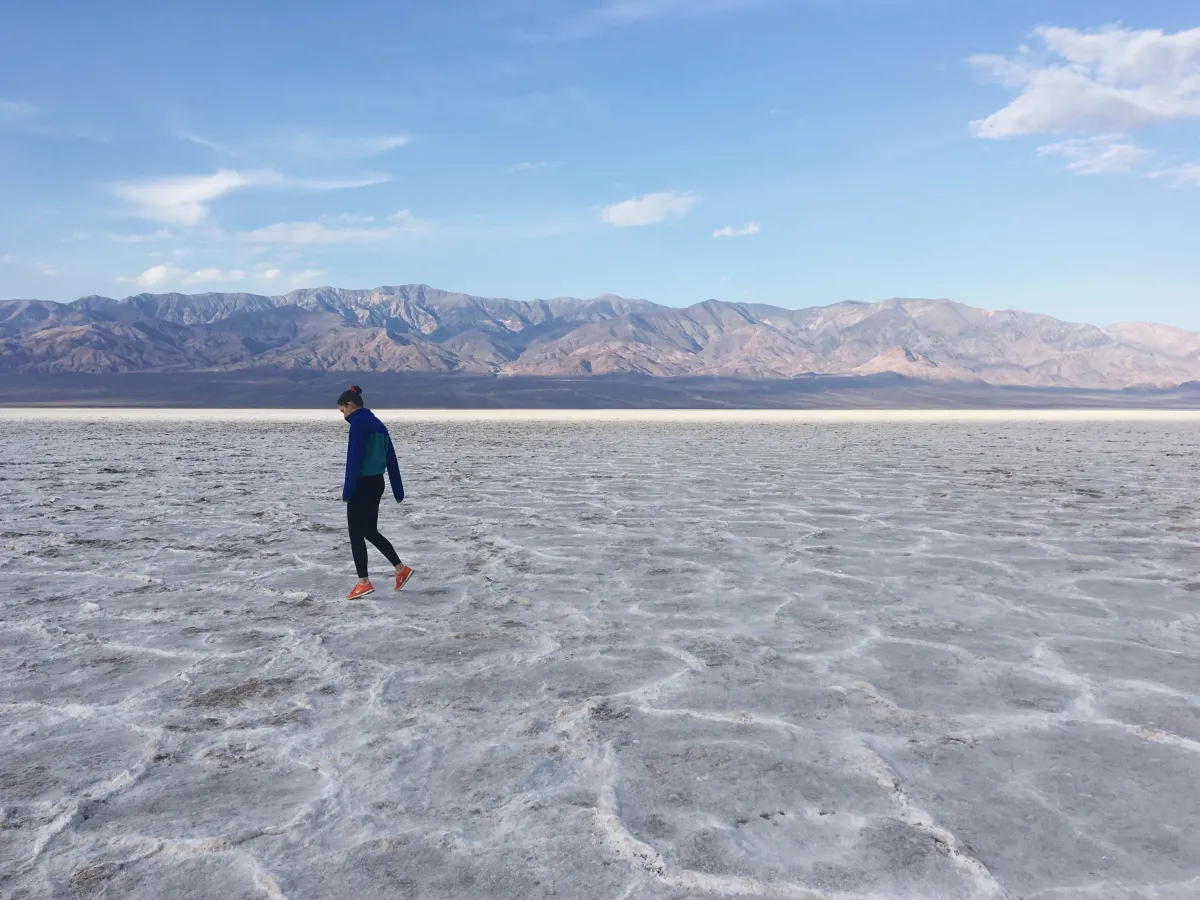 Hiker on the salt flats of Badwater Basin, Death Valley