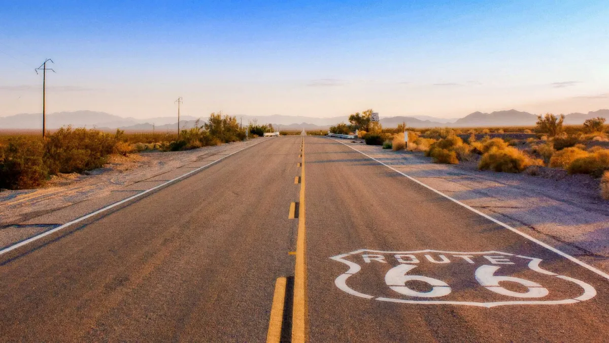 Route 66 shield painted on a desert highway