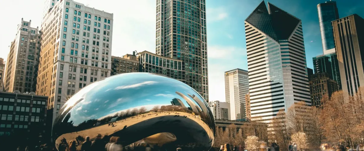 Chicago skyline featuring iconic architectural landmarks and the Cloud Gate sculpture