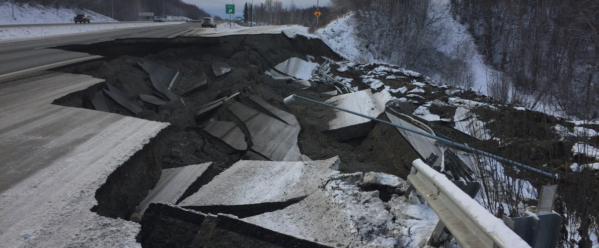 Cracked road with large fissure after major Alaska earthquake