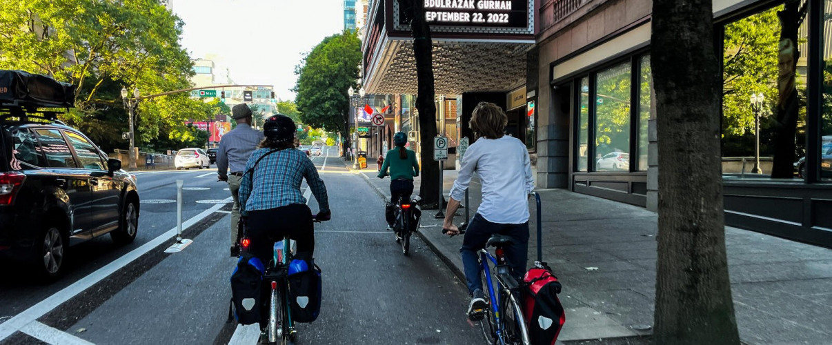 Cyclists using a protected bike lane in downtown Portland