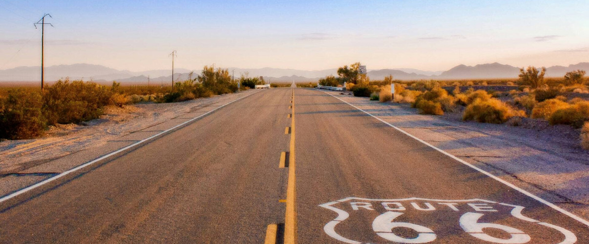 Route 66 iconic road sign open highway desert Historic Route 66 highway sign in the open American Southwest desert landscape