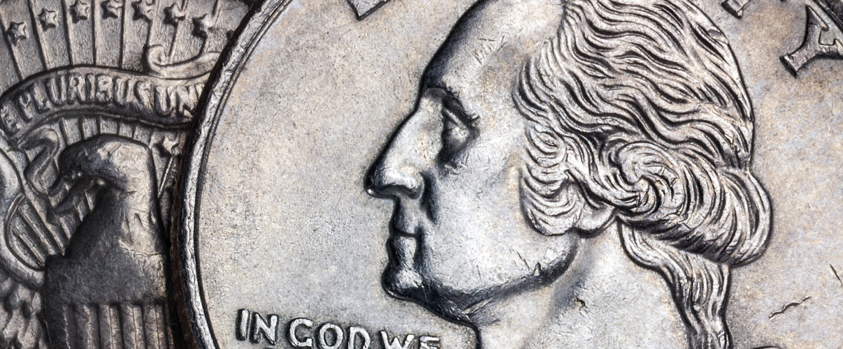 Close-up of United States currency featuring the In God We Trust motto