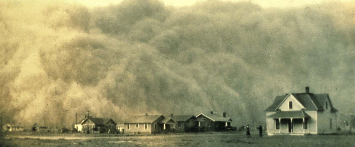 Massive dust storm approaching a rural farm during the 1930s Dust Bowl