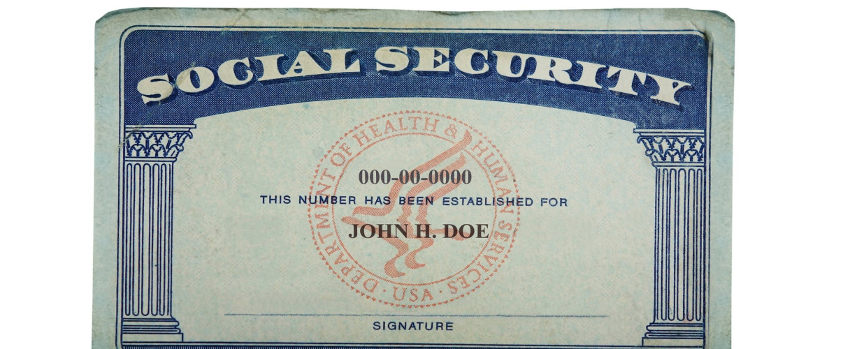 Social Security card with tax forms and retirement benefit statements