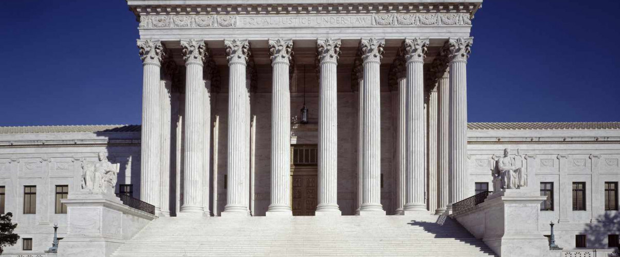 The iconic white marble U.S. Supreme Court building with its famous steps and columns in Washington DC
