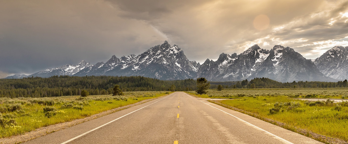 Vast empty plains stretching to distant mountains in rural Wyoming