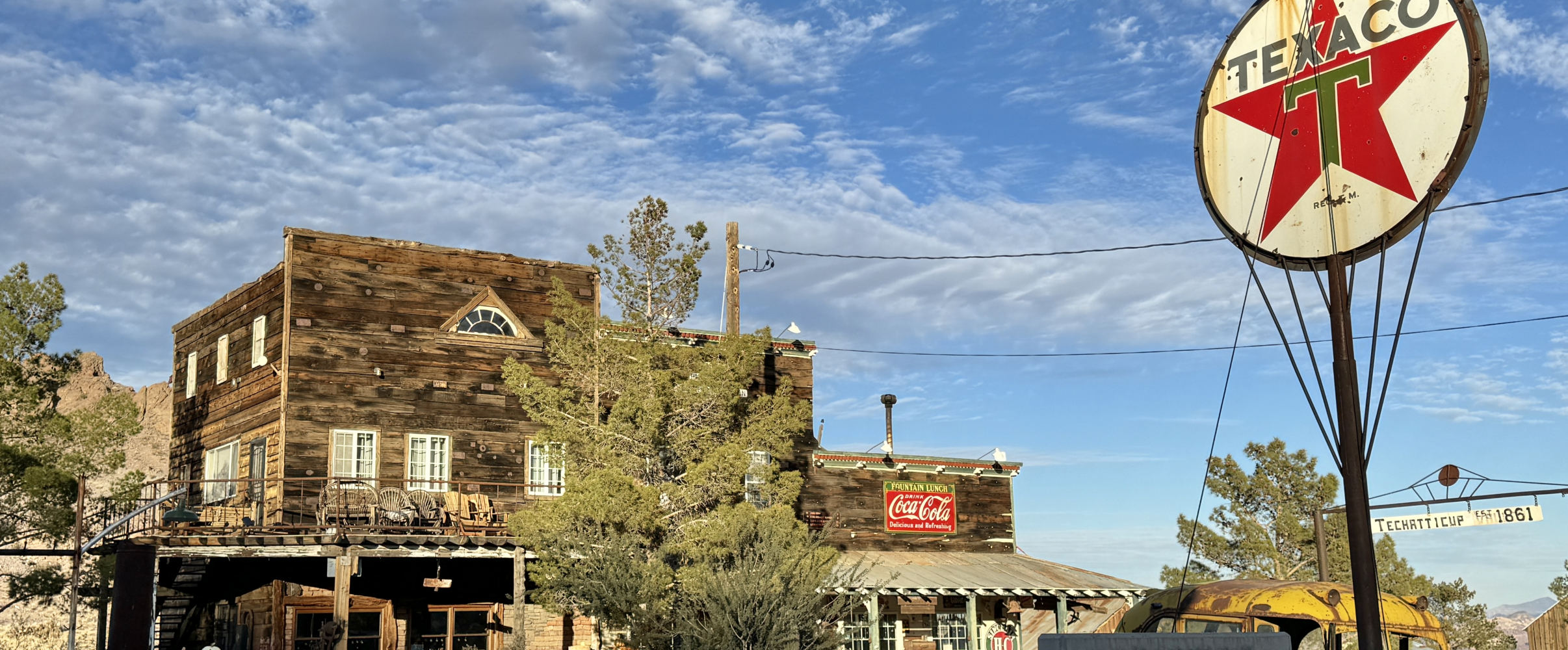 Abandoned mining town nevada Abandoned buildings in Rhyolite, Nevada ghost town with desert mountains in background