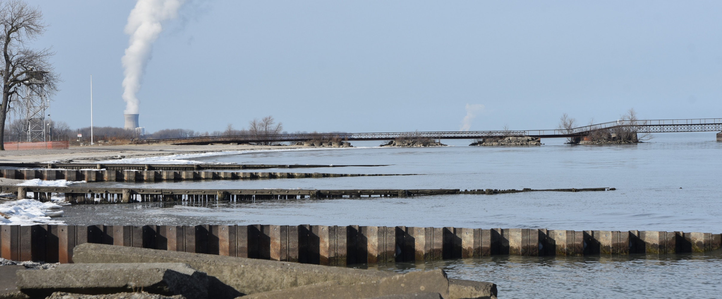 Aerial view great lakes industrial shoreline Aerial view of industrial shoreline along the Great Lakes with cargo ships and manufacturing facilities