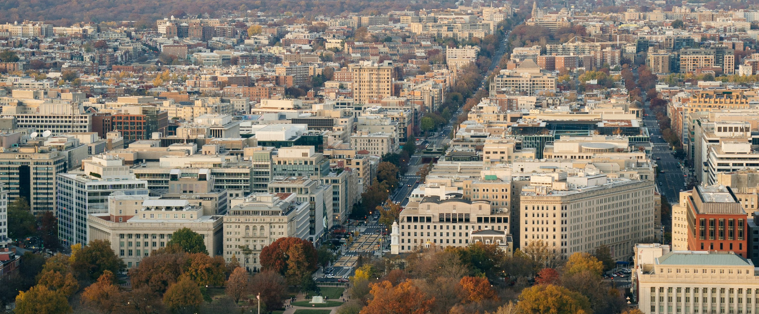 Aerial view of Washington D.C. showing the Capitol Building, National Mall, and surrounding government buildings