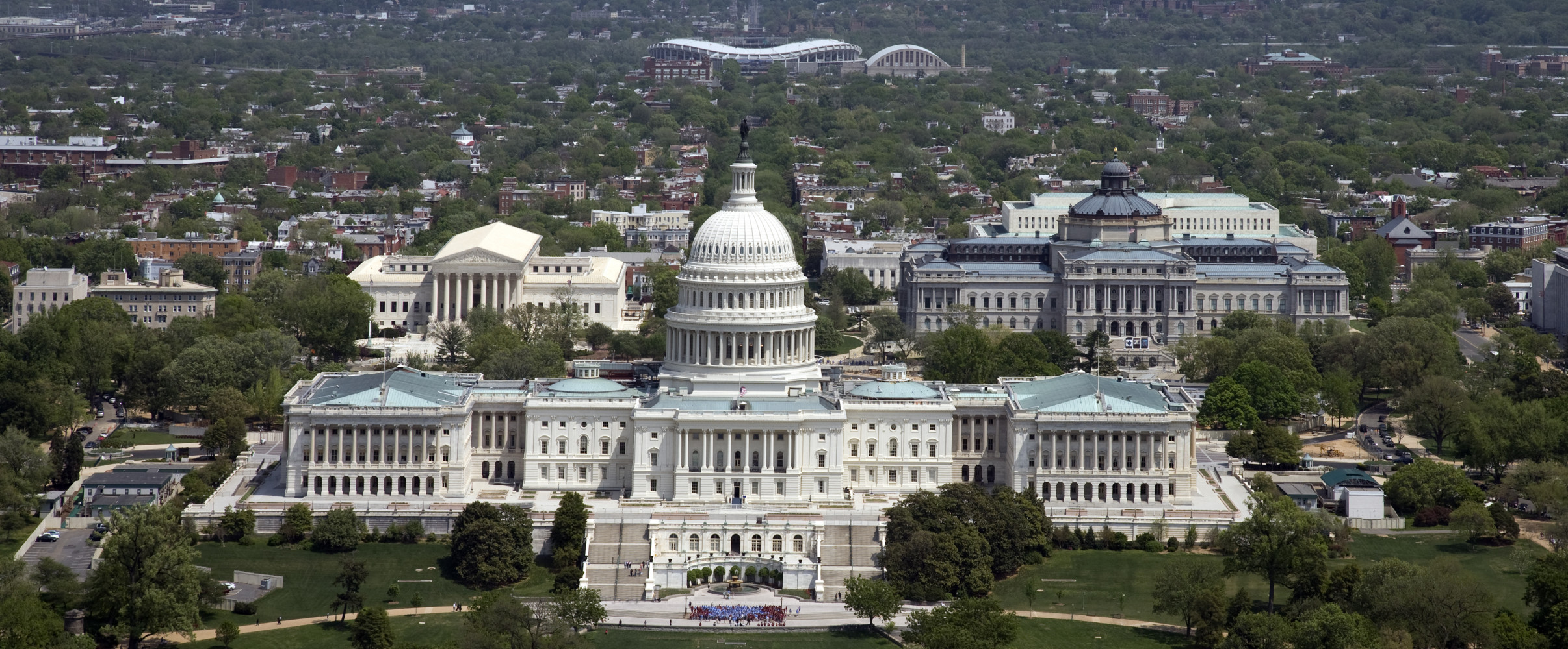 Aerial view of Washington D.C. showing the Capitol Building, National Mall, and monuments