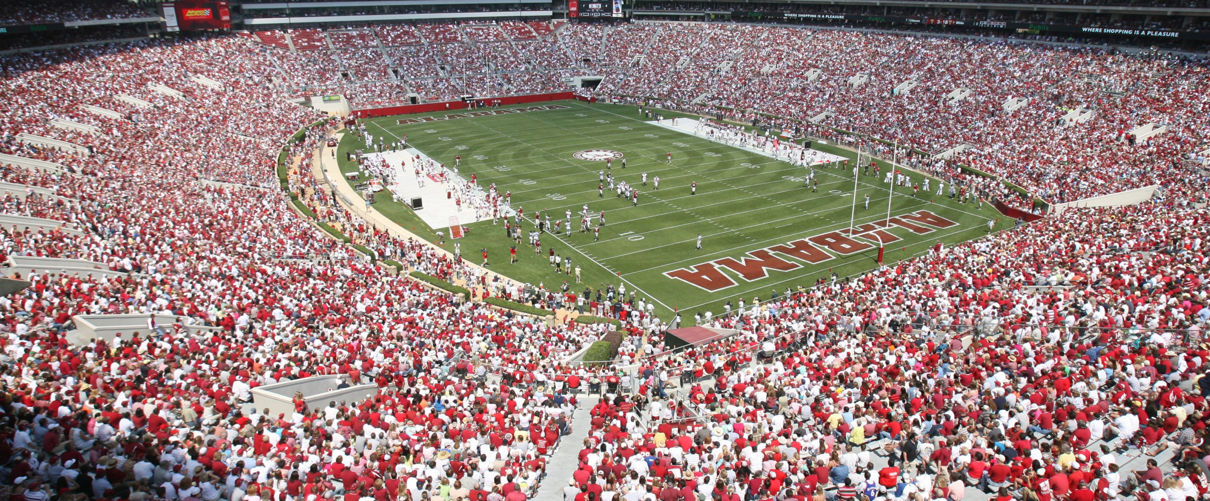 Packed NFL stadium with thousands of fans watching an American football game