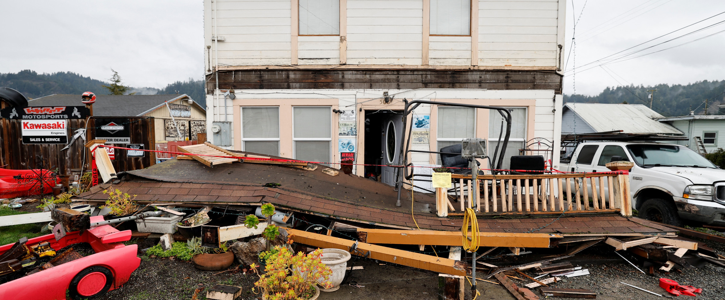 California earthquake damage Damaged buildings and cracked roads following a major earthquake in California