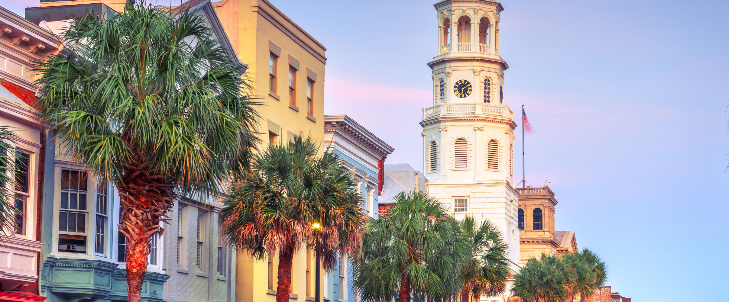 Charleston south carolina historic district Colorful historic buildings along Charleston's waterfront with palm trees