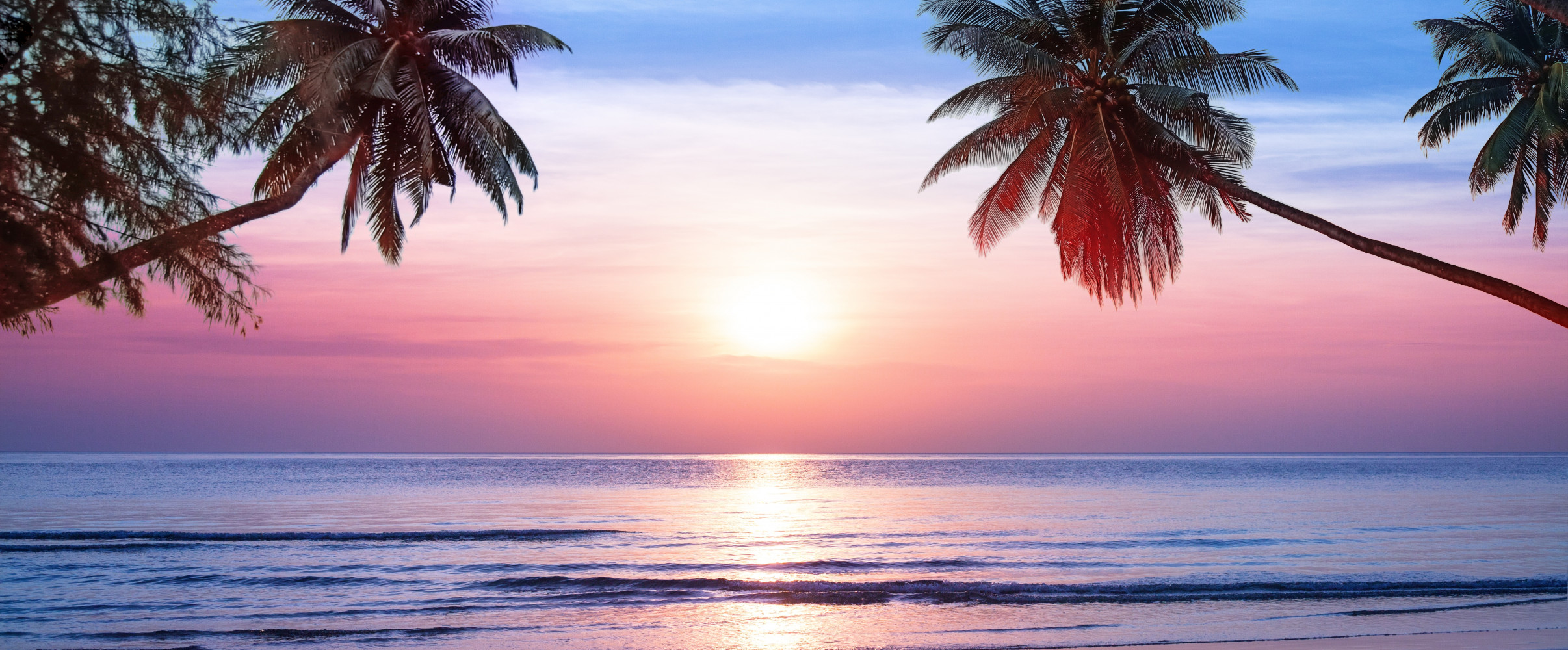 Hawaiian beach sunset Stunning Hawaiian beach at sunset with swaying palm trees and crystal clear turquoise water