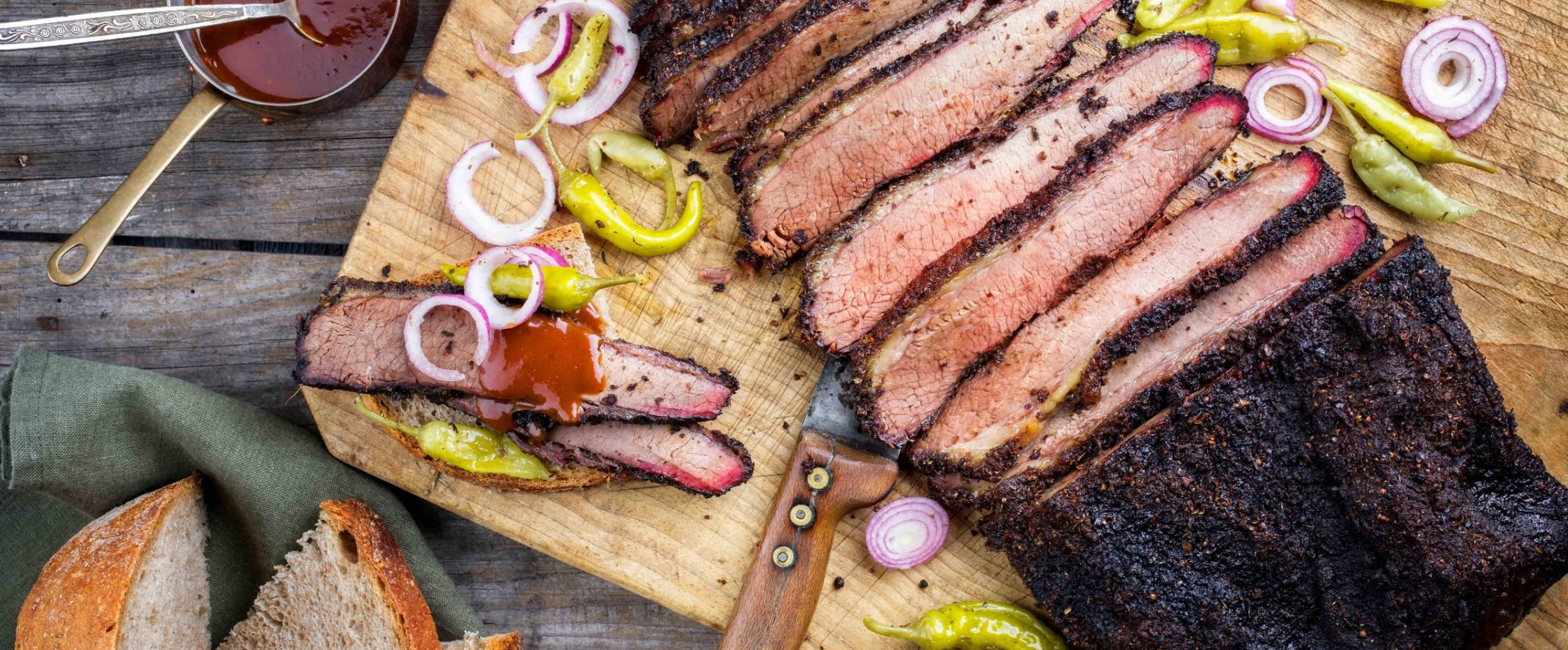 Juicy sliced brisket with smoke ring served on butcher paper at a Texas barbecue joint