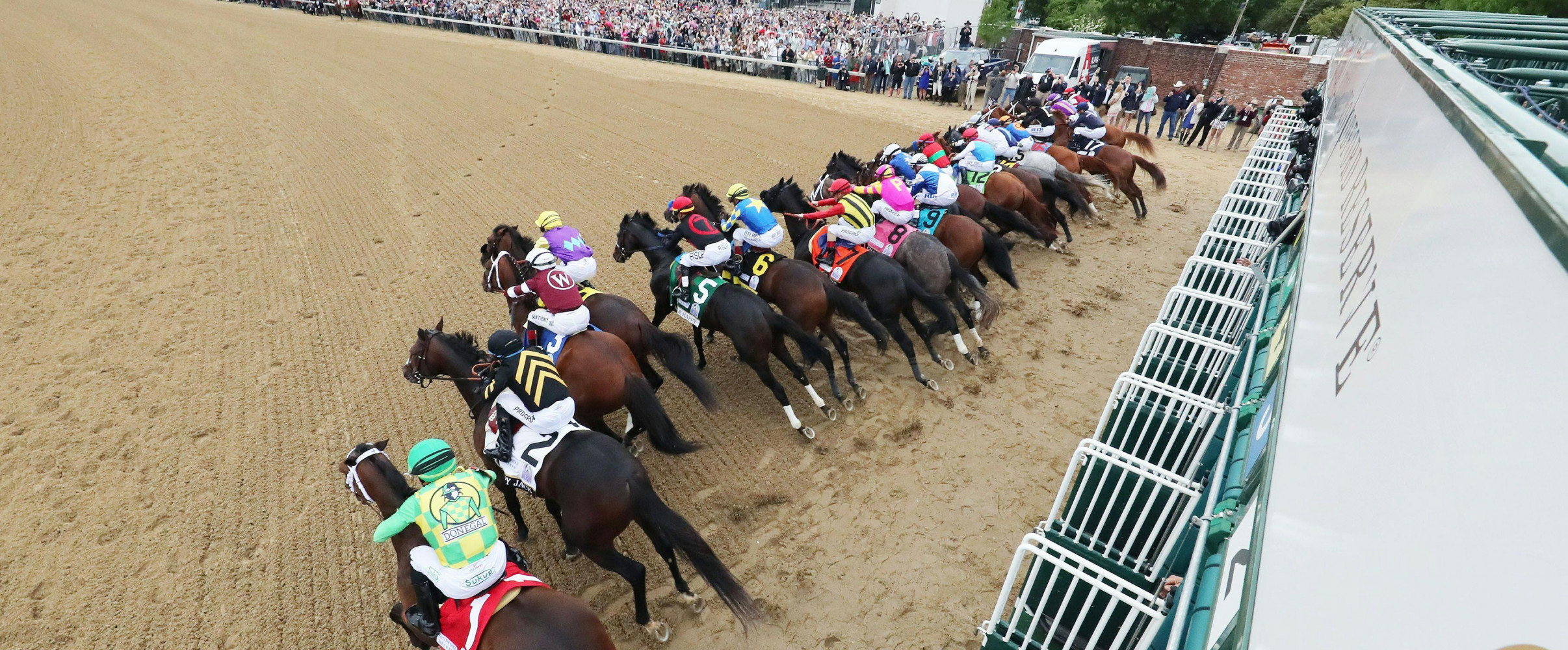 Thoroughbred horses racing at Churchill Downs during the Kentucky Derby