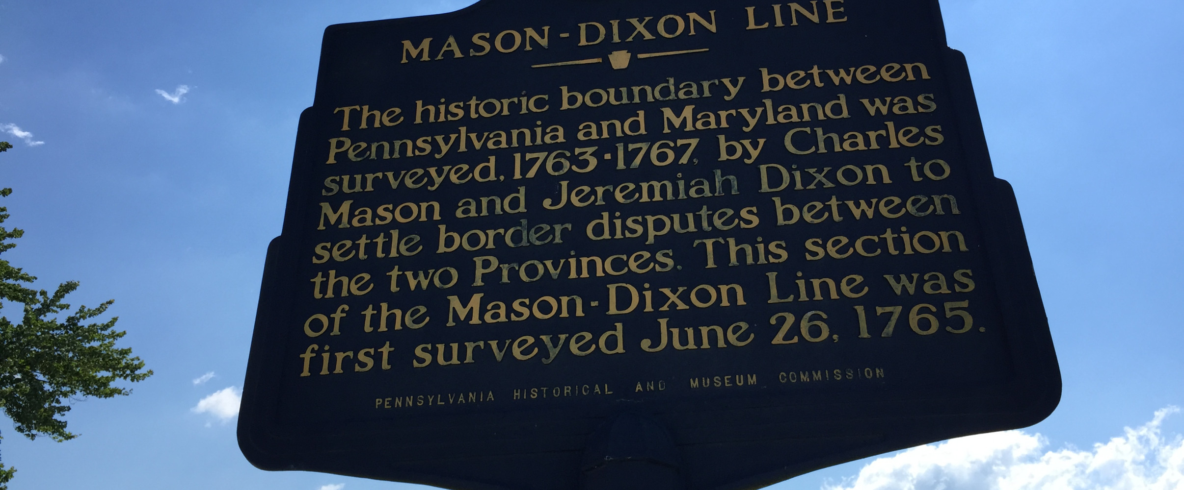 Mason dixon line historical marker Historical stone marker of the Mason-Dixon Line with state boundary inscription