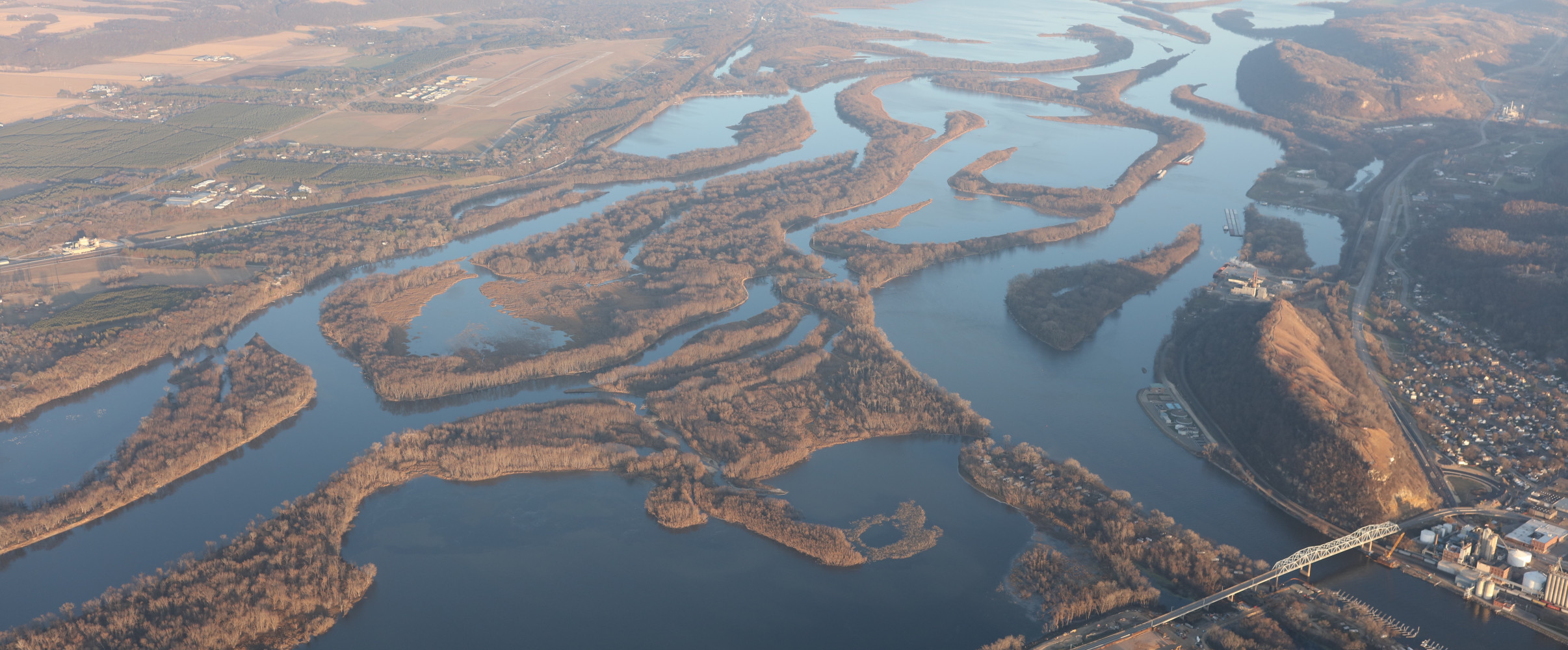 Mississippi River aerial view Aerial view of the winding Mississippi River flowing through green landscape