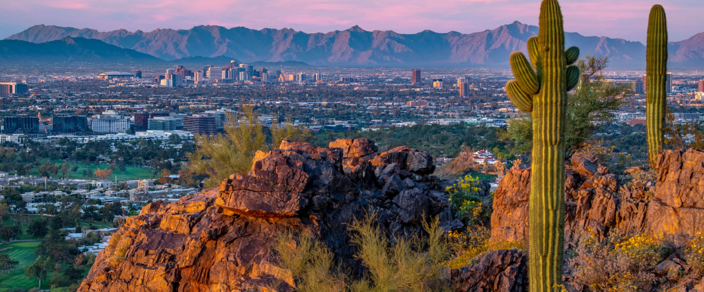 Phoenix skyline against brilliant blue sky with sunshine