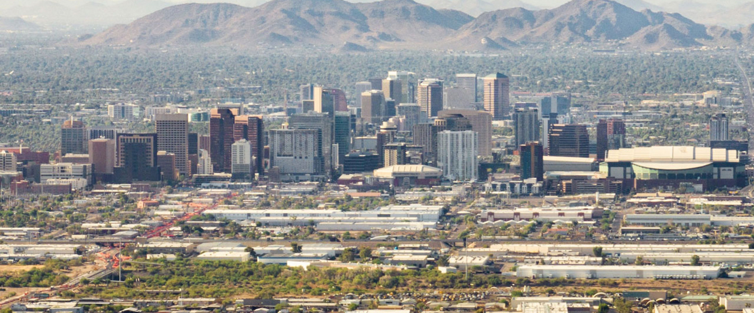 Downtown Phoenix skyline with heat waves visible over the desert landscape