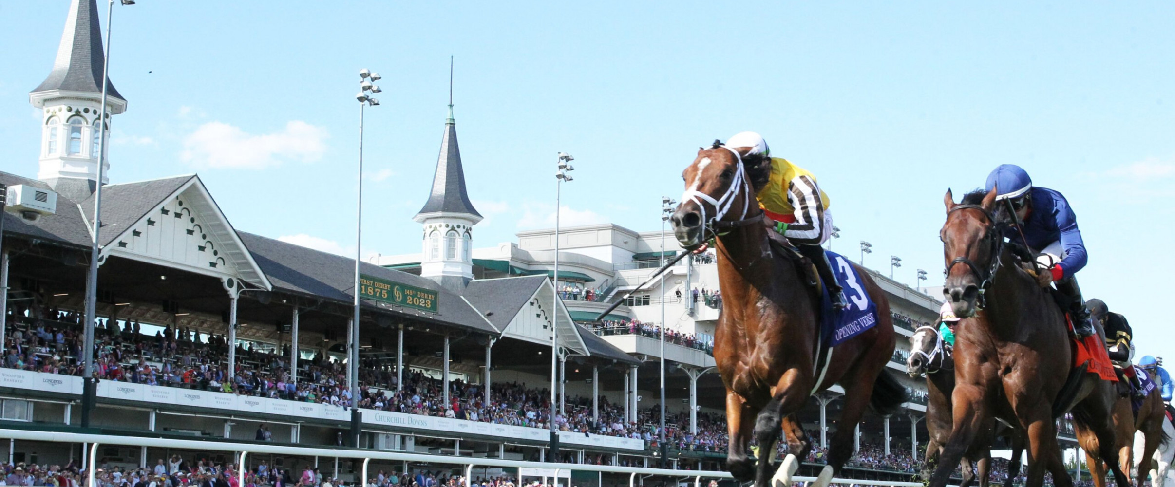 Thoroughbred horses racing at Churchill Downs during Kentucky Derby