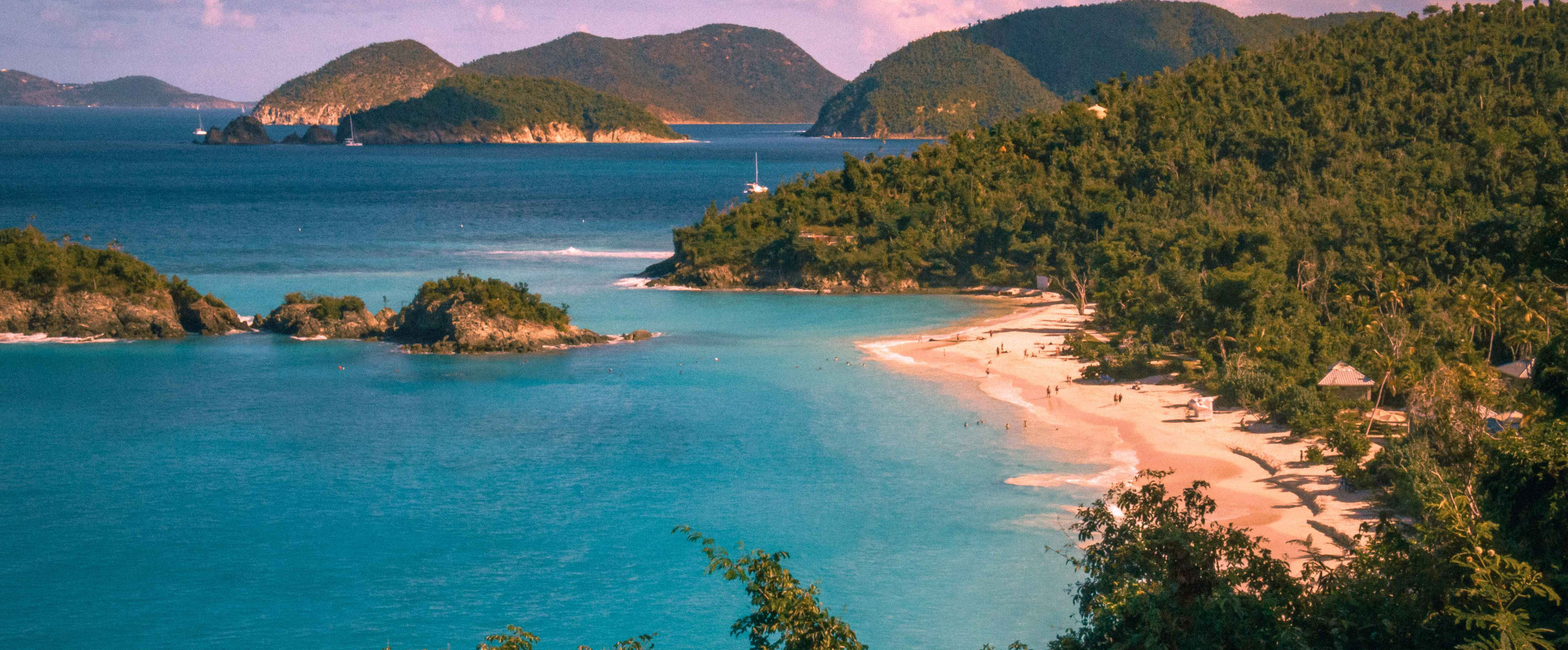 Pristine turquoise beach with palm trees in the US Virgin Islands