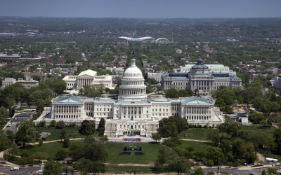 Aerial view of Washington D.C. showing the Capitol Building, National Mall, and monuments