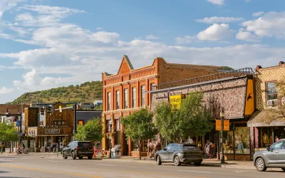 Tree-lined main street in charming American small town with historic storefronts