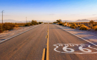 Historic Route 66 highway sign in the open American Southwest desert landscape