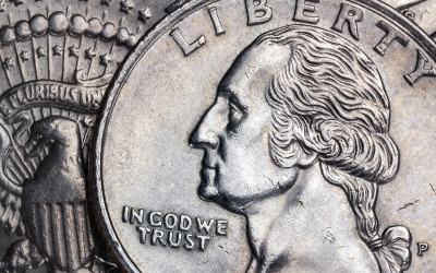 Close-up of United States currency featuring the In God We Trust motto