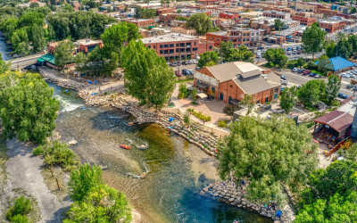 Picturesque riverside town with historic buildings along a calm river