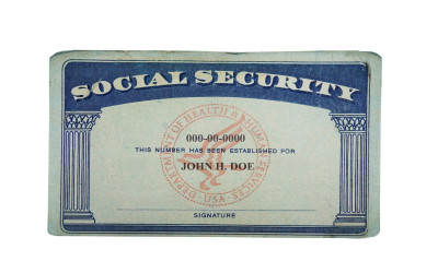 Social Security card with tax forms and retirement benefit statements