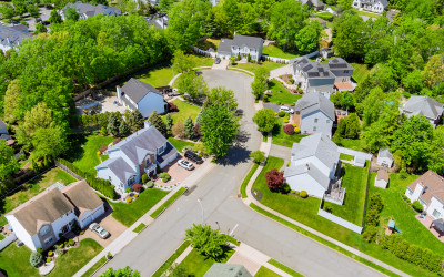 Aerial view of suburban neighborhood with single-family homes