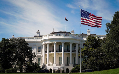 The White House with American flag flying prominently in front