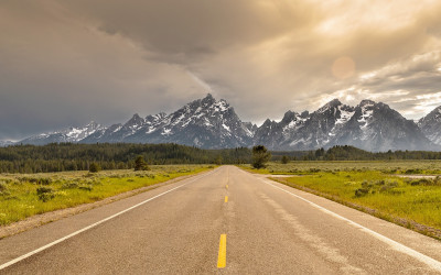 Vast empty plains stretching to distant mountains in rural Wyoming
