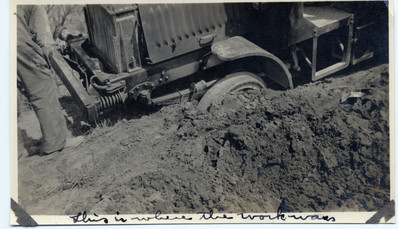 Military convoy of vehicles on dirt road in 1919