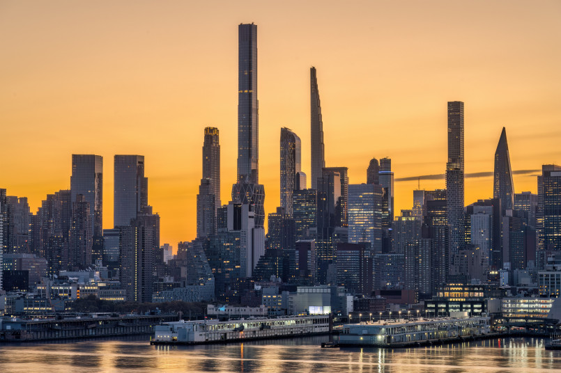 432 Park Avenue tower rising high above the Manhattan skyline with its distinctive grid pattern