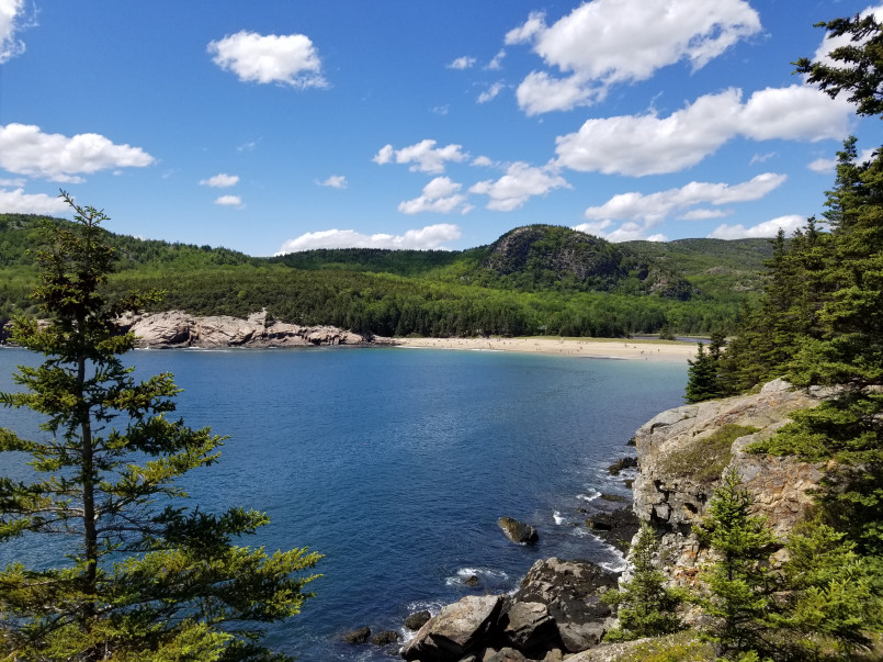 Acadia National Park coastal trail Hikers on rocky coastal trail with Atlantic Ocean views in Acadia National Park