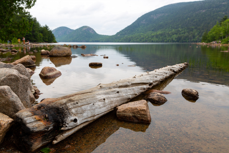 Scenic view of Jordan Pond in Acadia National Park with mountains reflected in calm water