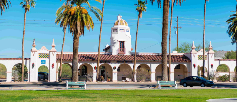 Spanish colonial revival plaza in Ajo Arizona with white arched buildings