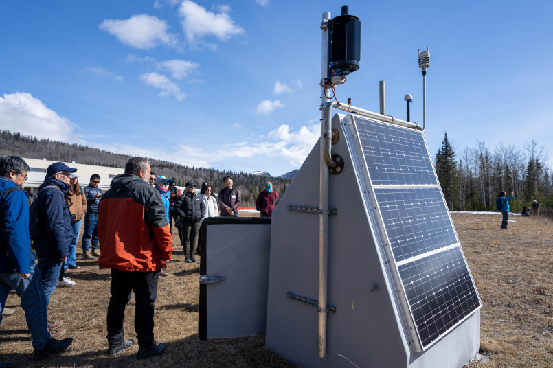 Alaska earthquake monitoring station Modern seismic monitoring station in rural Alaska with solar panels and satellite communication equipment