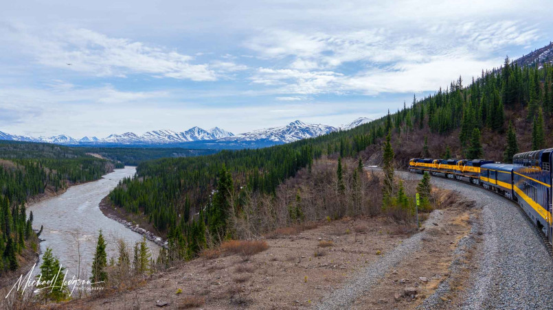 Alaska railroad denali national park Alaska Railroad train with view of Denali mountain peak